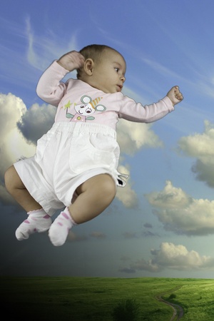 Baby Face with Sky Background, Italyの写真素材