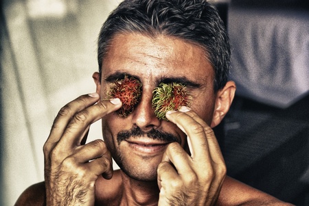 Adult playing with Fruit, Thailandの写真素材