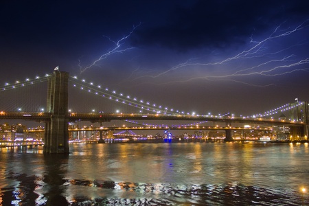 Storm in the Night over Brooklyn Bridge in New York Cityの写真素材