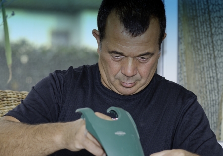 Worker repairing a Vacuum Cleaner, Italy