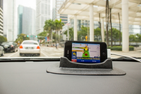 MIAMI - FEB 27: Gps Navigator shows trip directions in the middle of Miami, February 27th, 2011 in...