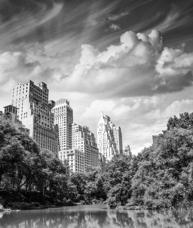New York City - Manhattan Skyscrapers from Central Park with Trees and Lake.の写真素材