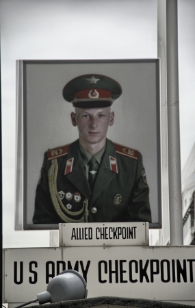 BERLIN - JUN 14: Checkpoint Charlie, on June 14th, 2012 in Berlin, Germany. Checkpoint Charlie is a...