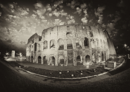 Dramatic sky above Colosseum in Rome  Night view of Flavian Amphitheatreの写真素材