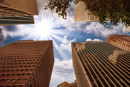 Beautiful upward view of tall Skyscrapers with dramatic sky.のeditorial素材