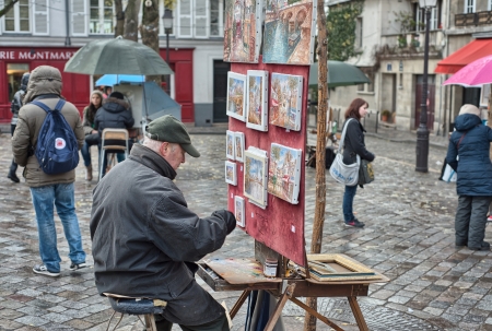 PARIS - DEC 2: Tourists enjoy Montmartre narrow streets, December 2, 2012 in Paris. More than 40 million people visit Paris every year.のeditorial素材