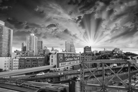 New York City. Terrific sunset view from Brooklyn Bridge with Skyscrapers in summer season.のeditorial素材