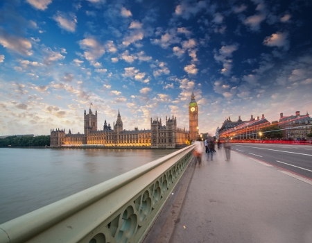 Westminster Bridge in London, UK. Beautiful view of Houses of Parliament and street lights at sunset.のeditorial素材
