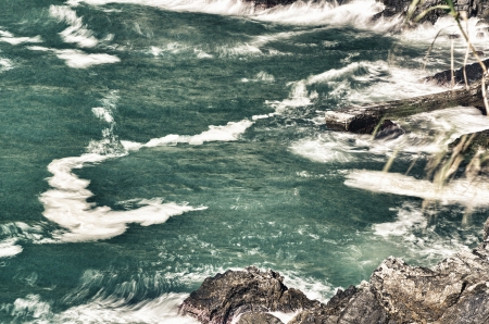 Long exposure moody dramatic seascape with rocks and motion blur, Cinque Terre.