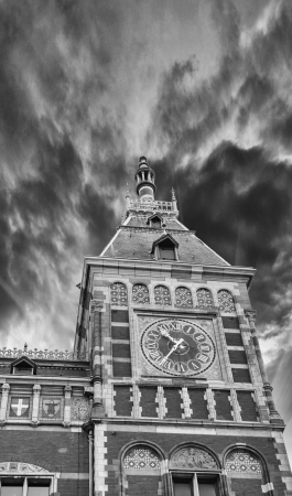 The Amsterdam Central Station, beautiful architecture at sunset.