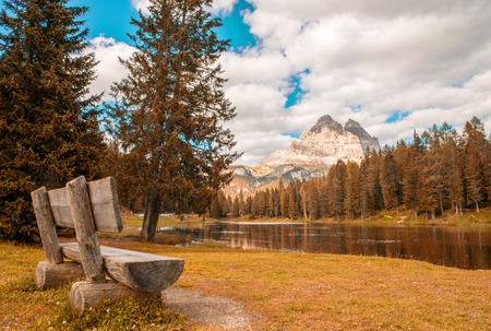 Solitaire bench with beautiful lake and mountain view - Three Peaks of Lavaredo.の写真素材