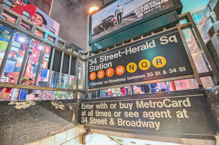 NEW YORK - JUN 12, 2013: 34 street subway station entrance with Times Square lights. New York City...