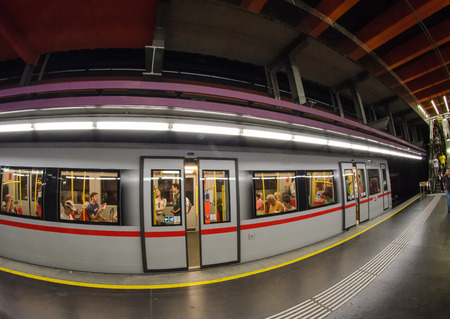 VIENNA - JULY 10, 2010: Subway train in a city station. More than 1.3 million passengers ride the Vienna U-Bahn every day.のeditorial素材