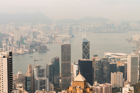 Hong Kong and Kowloon buildings. Aerial view of skyscrapers on a sunny afternoon.のeditorial素材