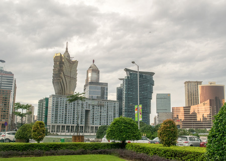 MACAU, CHINA - MAY 9, 2014: City skyscrapers and casinos dominate the skyline. Macau is rivalling...