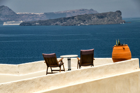Deckchairs of a wonderful island terrace.の写真素材