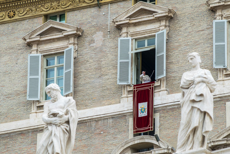 ROME, ITALY - JUNE 1, 2014: Pope Francis greets faithful in St. Peter's Square from his window at Basilica di San Pietro in Rome Italy.のeditorial素材