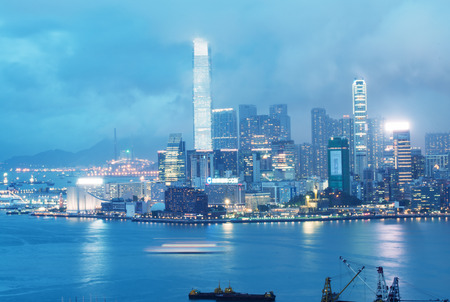 KOWLOON, HONG KONG - APRIL 22, 2014: View of Kowloon night skyline on a stormy night. Rainy season...
