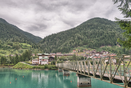 Bridge over the lake, mountain landscapeの写真素材