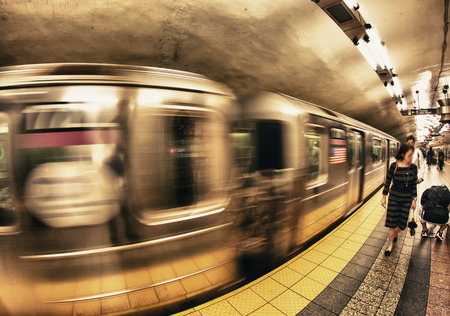 Train speeding up in New York subway.