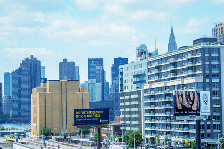 NEW YORK CITY - JUNE 15, 2013: Tourists walk along city streets. More than 50 milion people visit the city every year.のeditorial素材