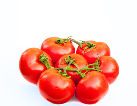 Fresh tomatoes isolated on white.の写真素材