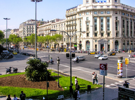 BARCELONA, SPAIN - MAY 21, 2005: Tourists enjoy city life on a beautiful spring day. More than 7...