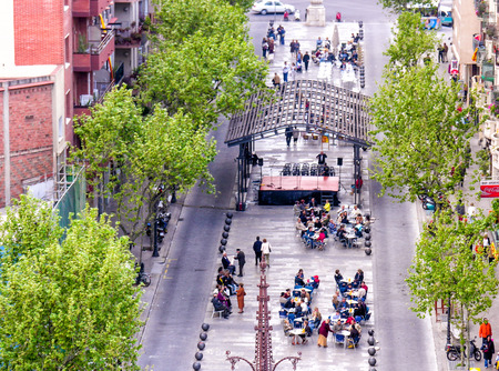 BARCELONA, SPAIN - MAY 21, 2005: Tourists enjoy city life on a beautiful spring day. More than 7...