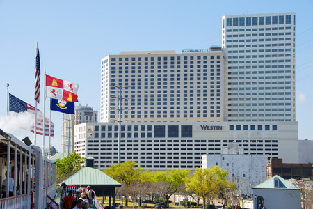 NEW ORLEANS - MARCH 6, 2009: City skyline on a beautiful sunny day. Almost 9 million people visit New Orleans every year.のeditorial素材