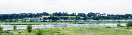 Panoramic view of medieval village over Loire river, France.の写真素材