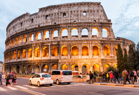 ROME - NOVEMBER 2, 2012: Tourists enjoy Colosseum at night. More than 15 million people visit the city every year..のeditorial素材