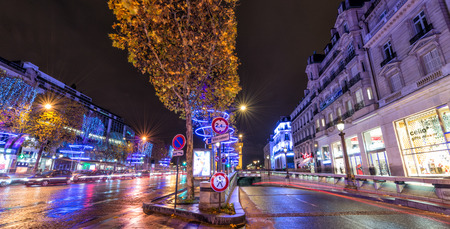 PARIS - DECEMBER 2, 2012: Lights of Champs Elysees at night. The famous avenue has a particular illumination during Christmas time.のeditorial素材