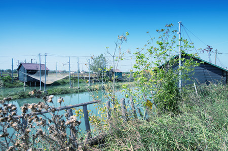 Fishing huts in Italy. People fish, cook and eat here.の写真素材