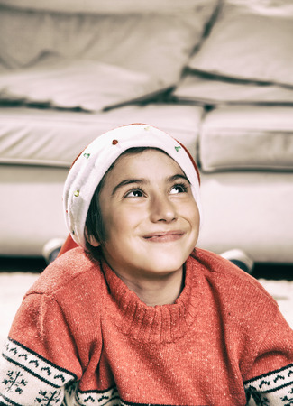 Happy young boy at home smiling for Christmas.の写真素材