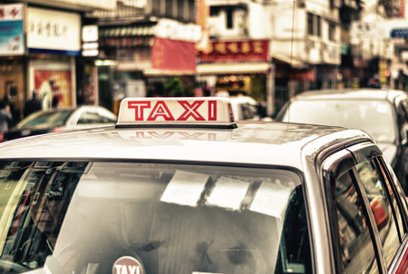 HONG KONG - APRIL 12: Taxis on the street on April 12, 2014 in Hong Kong. Over 90% daily travelers use public transport. Its the highest rank in the worldのeditorial素材