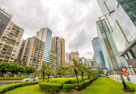 MACAU - MAY 10, 2014: Buildings of Macau on a cloudy day. Macau is one of the world's richest cities, with the highest GDP per capita by purchasing power parity as of 2013.のeditorial素材