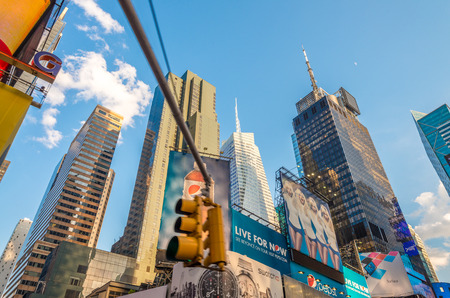 NEW YORK CITY - MAY 17, 2013: Ads and buildings of Times Square on a beautiful day, New York is visited by more than 50 million people annually.のeditorial素材