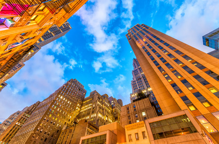 Bottom up amazing view of Manhattan skyscrapers at night. Streets of New York City.のeditorial素材