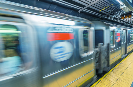 Fast moving train in Manhattan subway - New York transportation concept.のeditorial素材