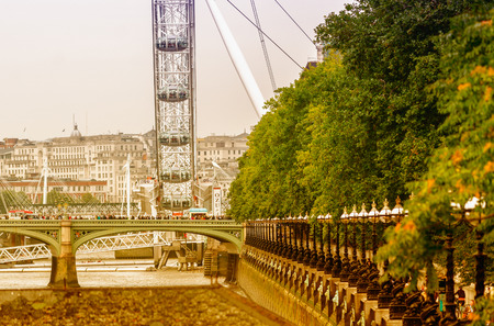 LONDON - SEPTEMBER 28, 2013: View of London Eye, Europe's tallest Ferris wheel on the South Bank of the River Thames, a famous tourist attraction.のeditorial素材