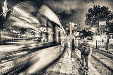 Istanbul train arriving in Sultanahmet Square at night.の写真素材