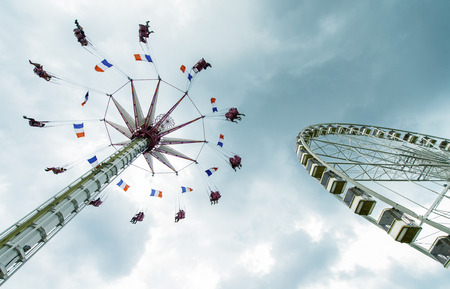 Amusement park against cloudy sky.のeditorial素材