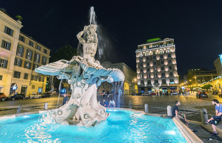 ROME - MAY 23, 2014: Tourists walk in Piazza del Tritone. More than 15 million people visit the city every year.のeditorial素材