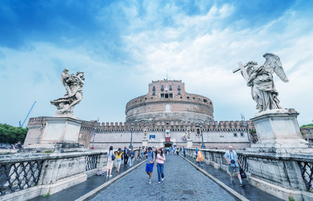 ROME - MAY 15, 2014: Tourists walk near Saint Angel Castle. More than 15 million people visit the city every year.のeditorial素材