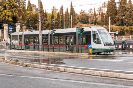 ROME - MAY 14, 2014: ATAC train speeds up in city cente. ATAC is the municipally-owned public transport company which operates most public transport lines in the city.のeditorial素材