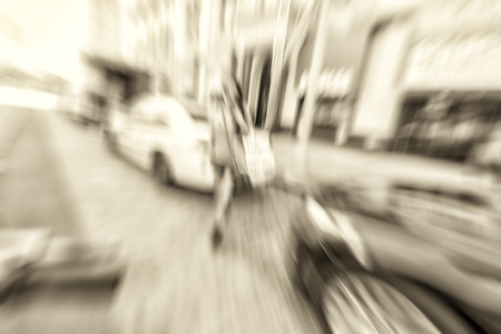 Blurred fast moving picture of beautiful woman walking in New York City.の写真素材