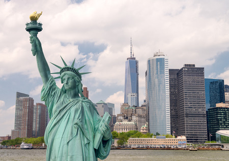New York City tourism concept. Statue of Liberty with Lower Manhattan skyline.の写真素材