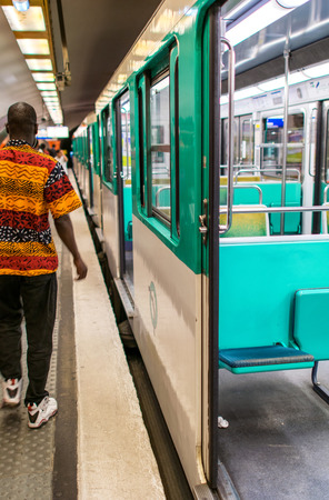 PARIS - JULY 20, 2014: Metropolitain train on a subway station. Paris Metro is the 2nd largest underground system worldwide by number of stations (300).のeditorial素材