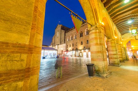 BOLOGNA - OCTOBER 21, 2014: Tourists in city center at night. Bologna is visited by more than 5 million people annually.のeditorial素材