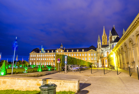 Caen. Normandy. Men Abbey exterior and gardens at night.のeditorial素材